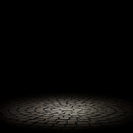 illuminated stone floor on a black background