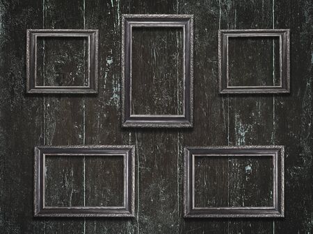 Old wooden frames on vintage wooden backgroundの写真素材