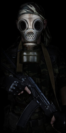 Soldier in a gas mask with a automatic rifle