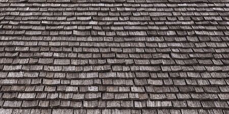 Old wooden roof tiles as a grunge backgroundの写真素材