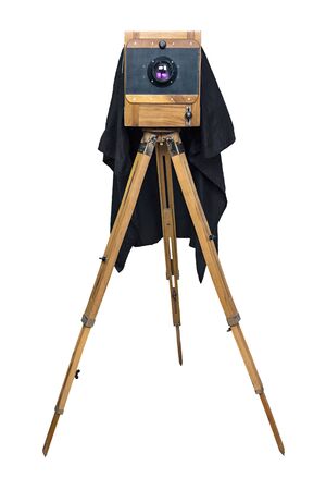 old wooden camera on a tripod isolated on white backgroundの写真素材