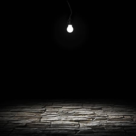 illuminated stone floor on a black backgroundの写真素材