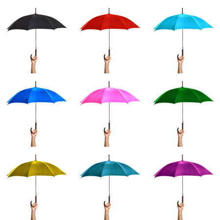 set of images Hand holding open colored umbrella isolated on white background.の写真素材