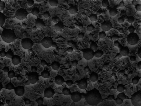 Abstract dark vintage texture in the form of a porous stone surface with round caverns. Created without the use of artificial intelligenceの写真素材