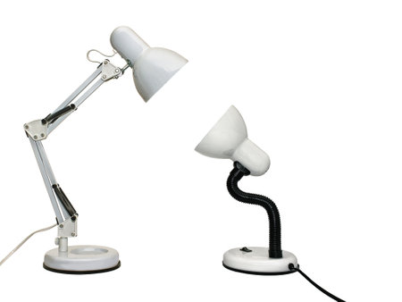 Two table electric lamps shining on each other. Isolated on white backgroundの写真素材