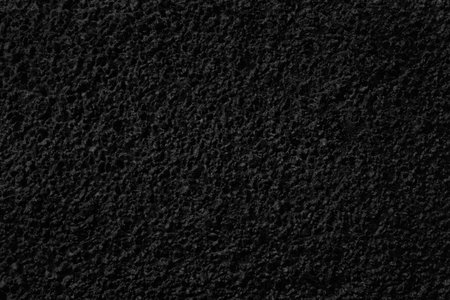 background of small stones filled with bitumenの写真素材