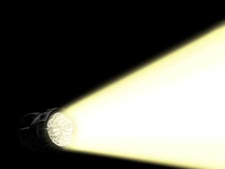 LED flashlight shines on a dark backgroundの写真素材