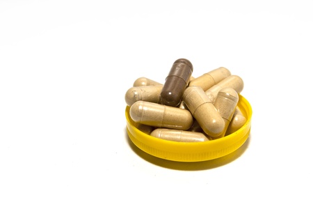 The ancient herbal capsule in yellow capの写真素材