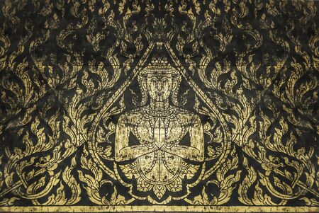 Old angel  pattern in traditional Thai style art painting on window of the temple this age more than 100 year oldの写真素材