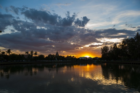 Temple in sunset sky with tree reflectionの写真素材