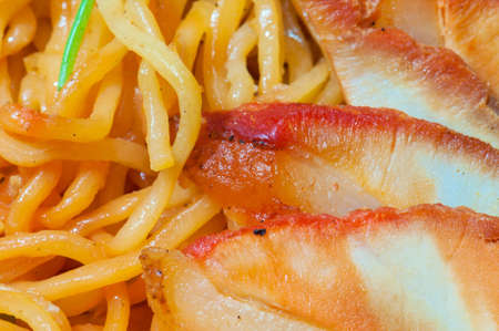 Chinese egg noodles with red porkの写真素材