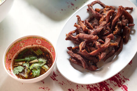  Fried pork and sauce on table .の写真素材