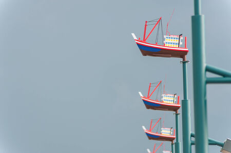 Toy Sail Boat on pillar blur technic .の写真素材