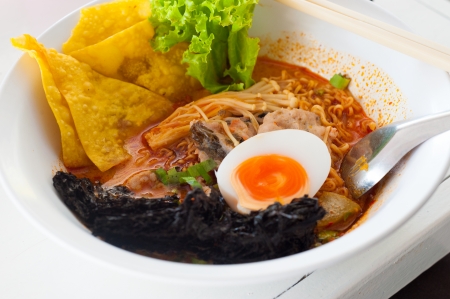 Pork noodle tom yum, condensed water egg の写真素材