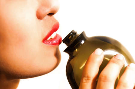 Sexy woman drinking somting small bottle .の写真素材