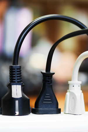 Wires plugged into power barの写真素材