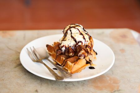 waffles withstawberry and caramel sauce .の写真素材