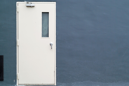 An White door with wet floor .の写真素材
