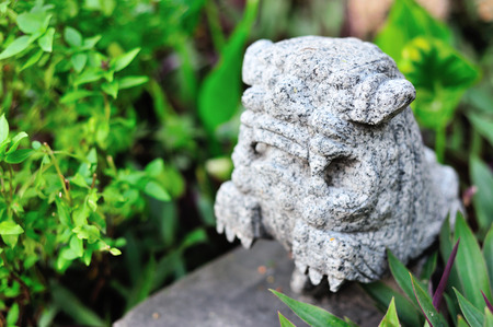 Lion statue in nature place soft light .の写真素材