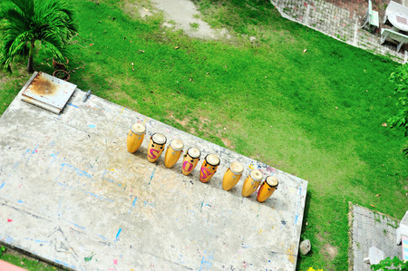 Drum thai on concrete floor and grass .の写真素材