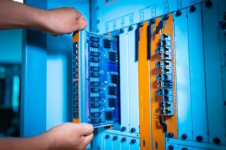 People fix core switch in network room .の写真素材