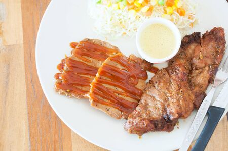 An steak in white disk soft light .の写真素材