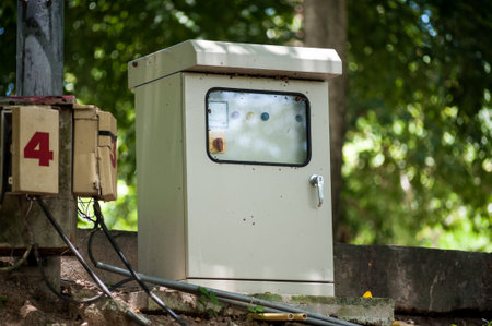 Electric outdoor fuse box in soft light .