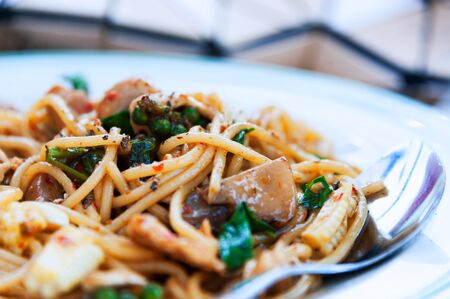 spaghetti in white disk with soft light .の写真素材