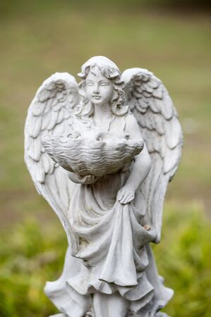 Angel statue in nature place in soft light .の写真素材