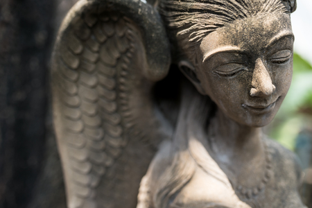 Angel statue in nature place in soft light .の写真素材