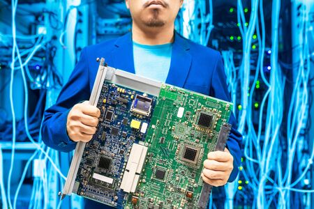 People fix core switch in network room .の写真素材