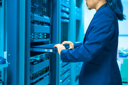 Man fix server network in data center room .の写真素材