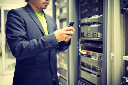 Man fix server network in data center room .の写真素材