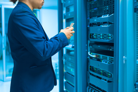 Man fix server network in data center room .の写真素材