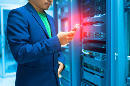 People Use smart phone in datacenter room .