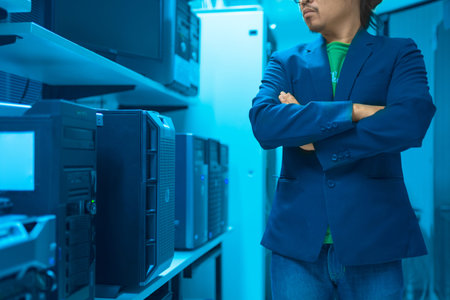 Man fix server network in data center room .