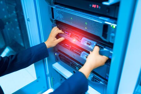 Man fix server network in data center room .の写真素材