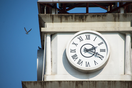 An Clock tower under a bright light .の写真素材