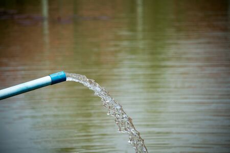 Flow Water pipe with  in nature place .の写真素材