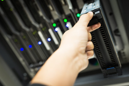 People fix node fiber optic in network room .
