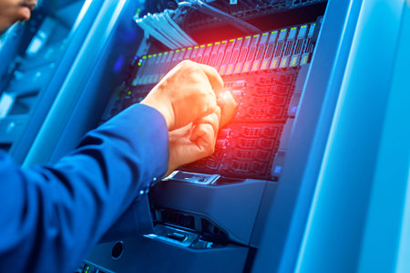 Man fix server network in data center room .