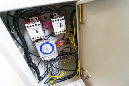 Electrical cabinet timer used to power large electrical equipment.