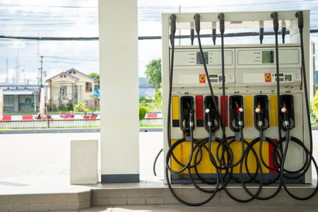 A stock photo of a gas station typically features a well-lit and clean fueling facility with various components that convey the concept of a gas station.の写真素材