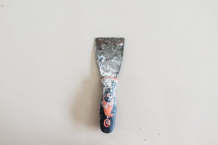 Cans of paint and trowel on a white background.の写真素材