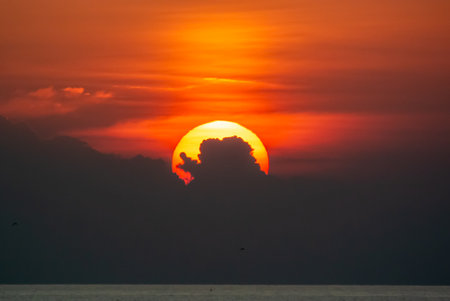 Sunset back cloud in sea .の写真素材