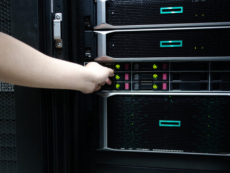 Man fixing server in data center room .