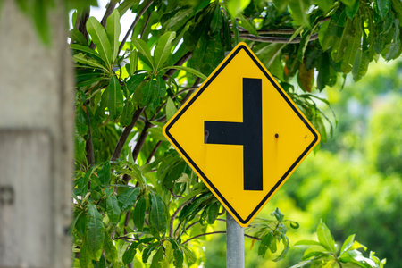 Distinctive intersection sign captured in a stock photo, symbolizing the convergence of paths and decisionsの写真素材
