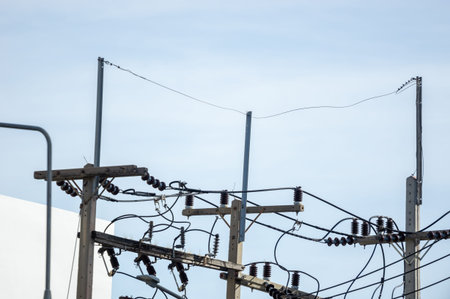An electrical pole that shows the disorder in the arrangement of the cables.