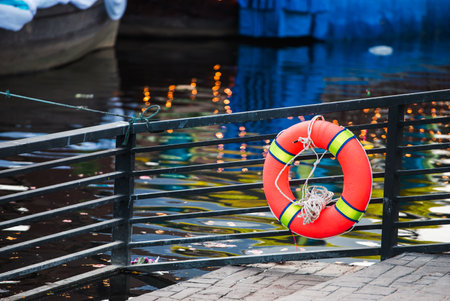 Life-saving rubber ring installed in the water areaの写真素材