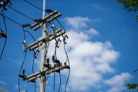 An electrical pole that shows the disorder in the arrangement of the cables.の写真素材